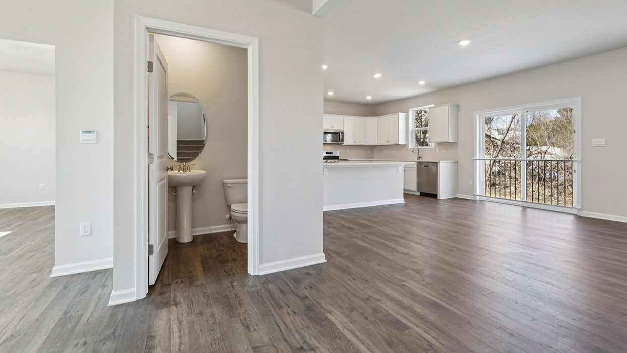 Main floor living level and view of the staircase to second floor