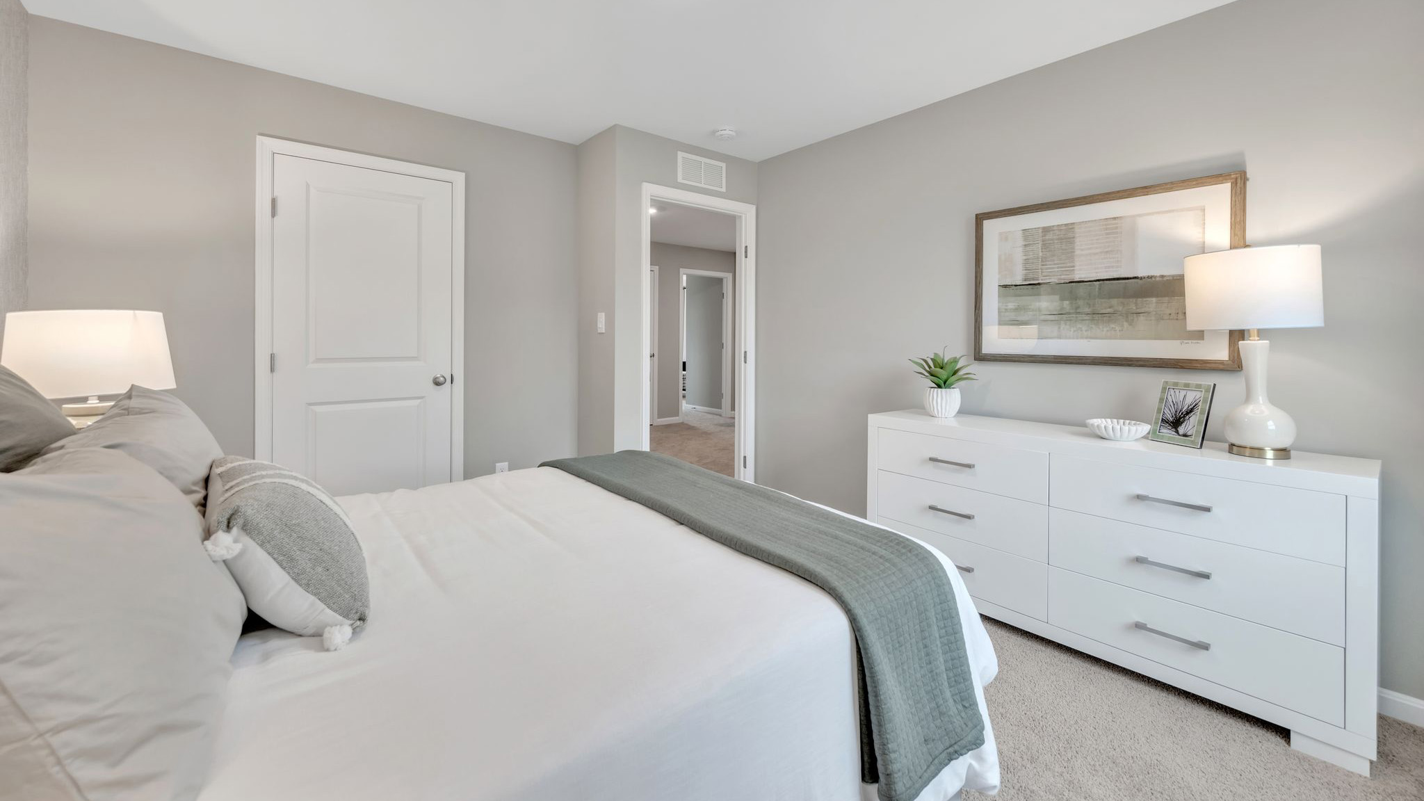 Three generously sized secondary bedrooms, and a spacious hall bathroom with double vanity complete the upstairs.