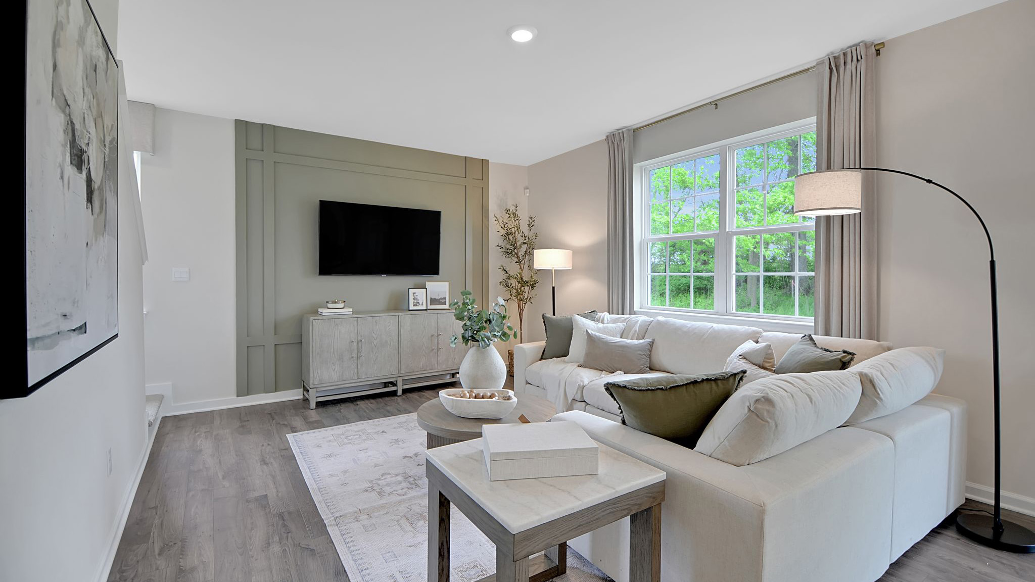 Living room area with double window to the right.