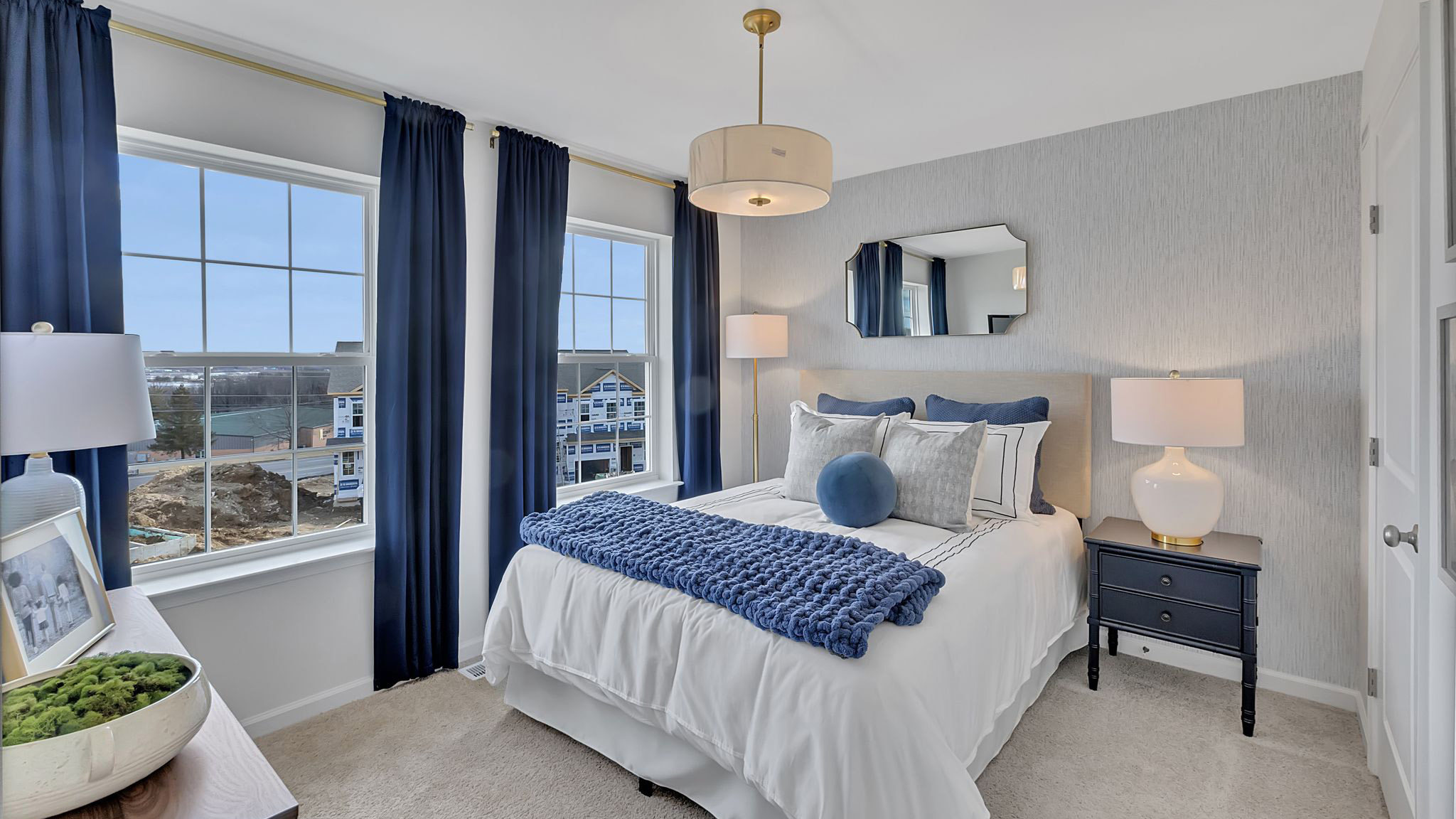 Bedroom three has two large windows.