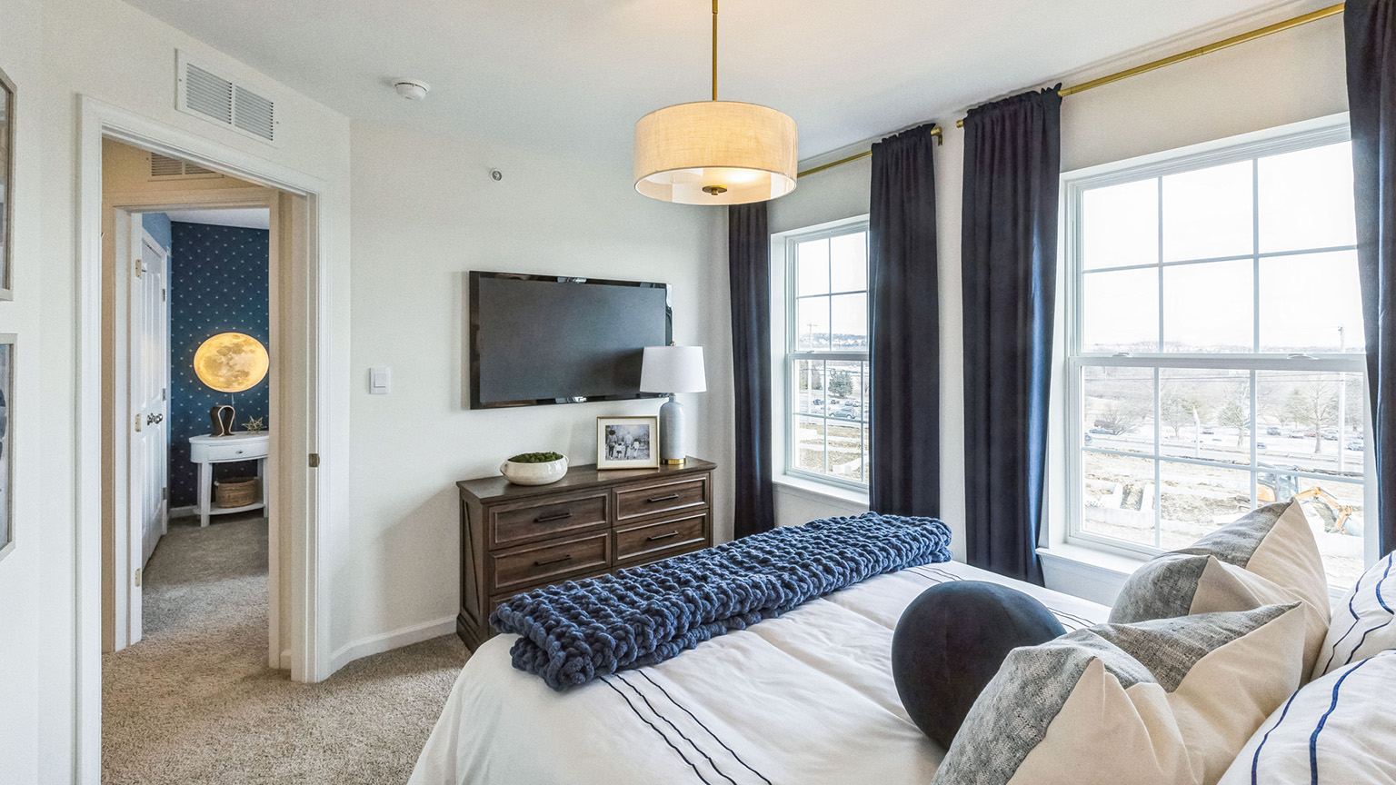 Bedroom three has a wall mounted TV.