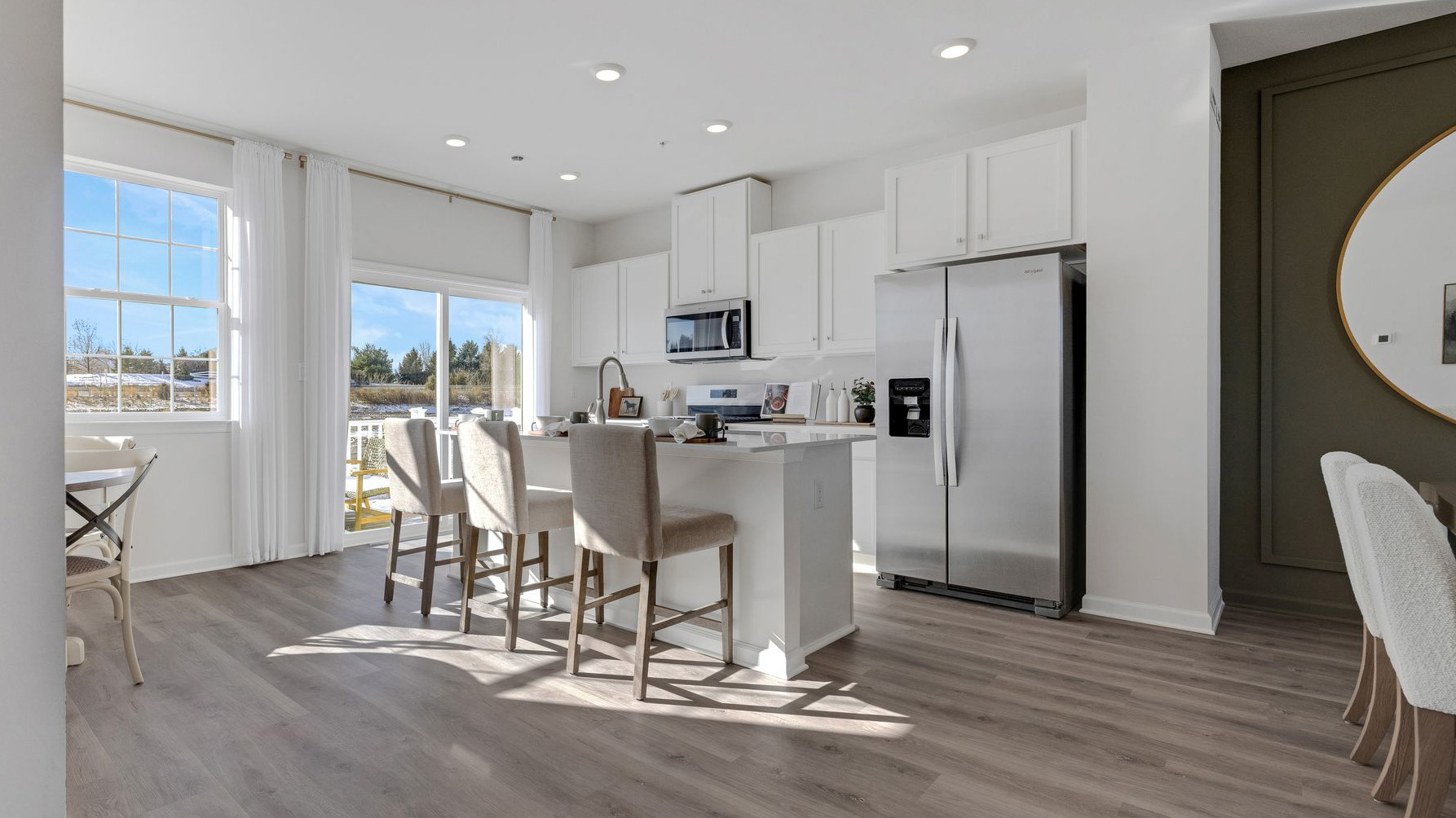 Kitchen area with sliding glass door and spacious deck on the back