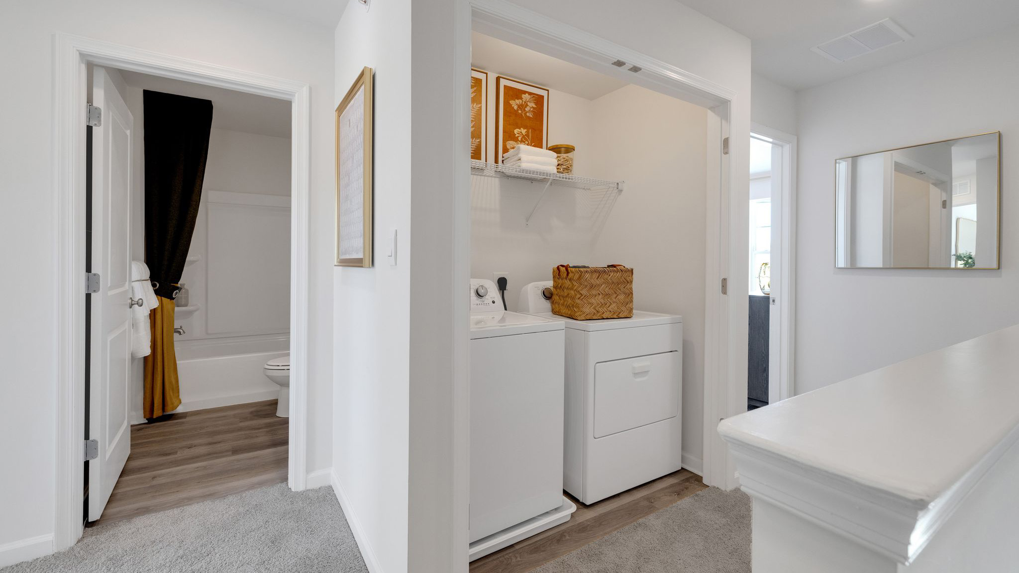 Laundry closet and the second full bath in the hallway on the third level.