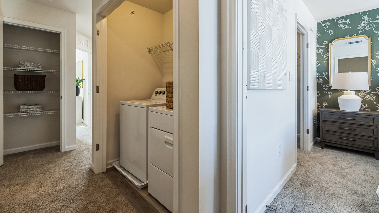 Laundry closet and the entrance to the primary bedroom.