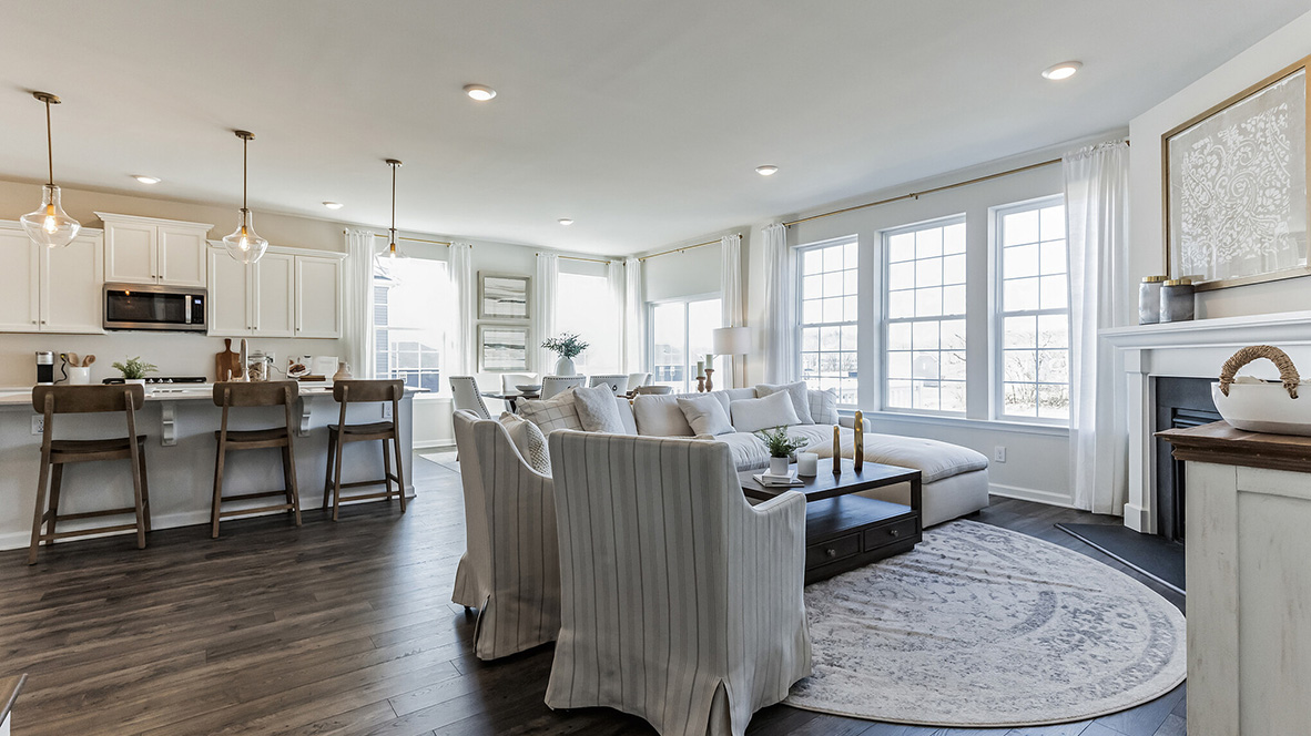 Wide view of the open layout near the living area with kitchen and casual dining area.