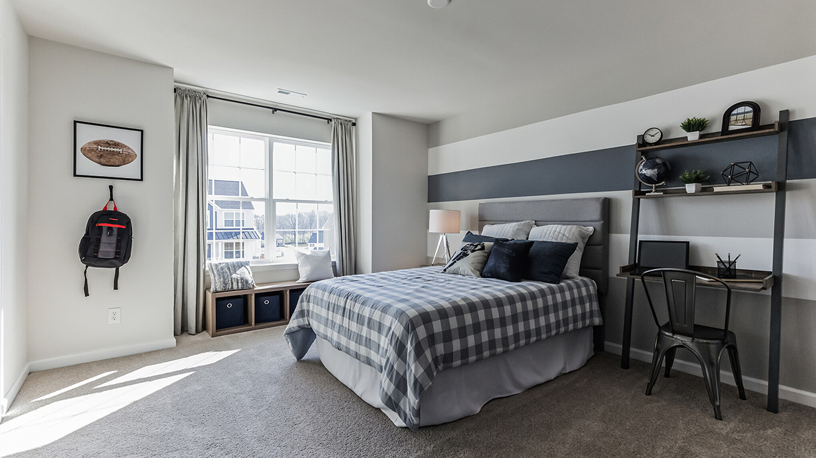 Third bedroom with large double window overlooking the front yard from the second floor.