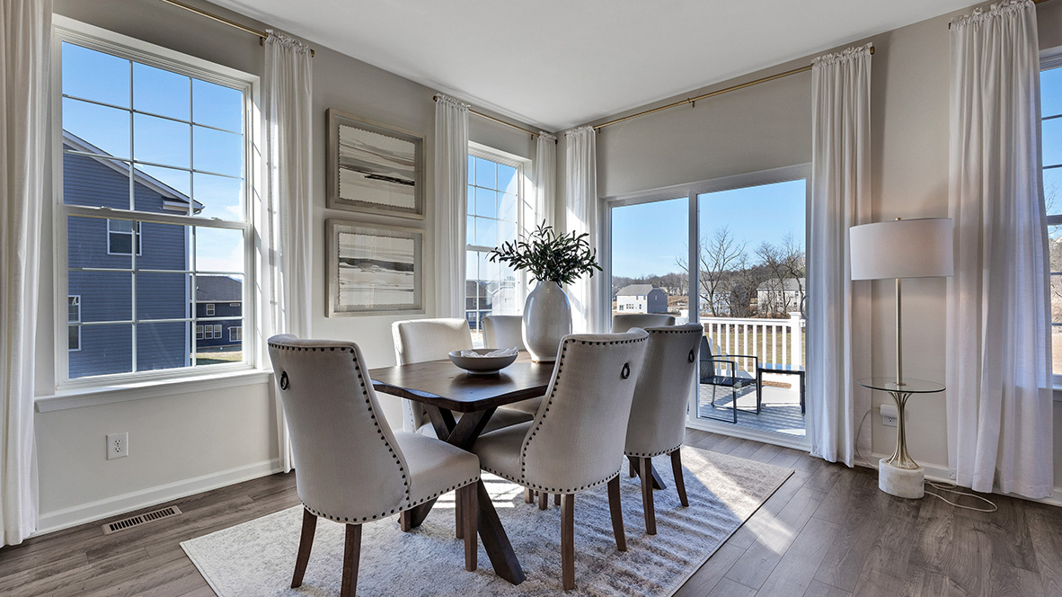 Focus on the casual dining area with back sliding glass door and back porch.