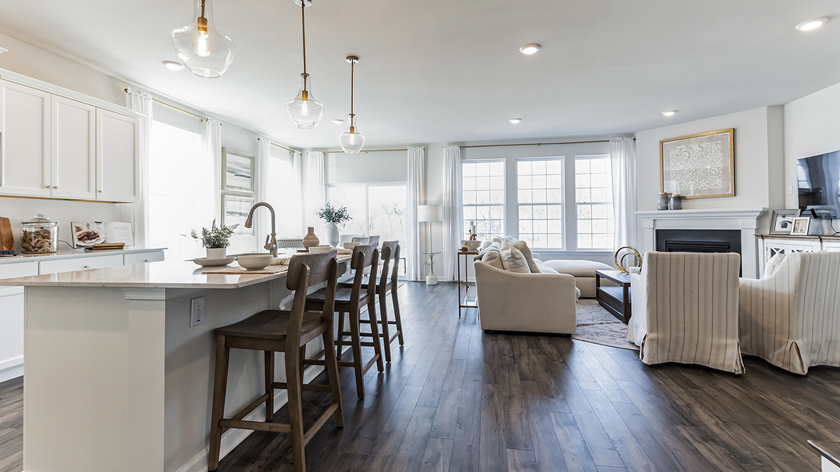 Kitchen island and living area with fireplace.
