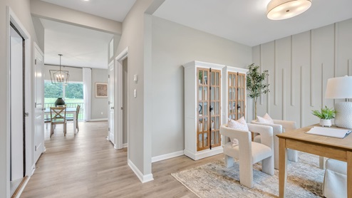 Open front room with easy access to dining area and kitchen,