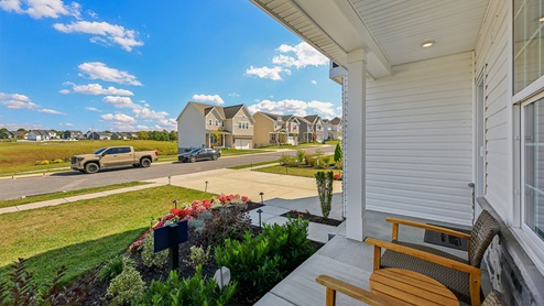 A view from the covered front porch looking towards the Paperback way