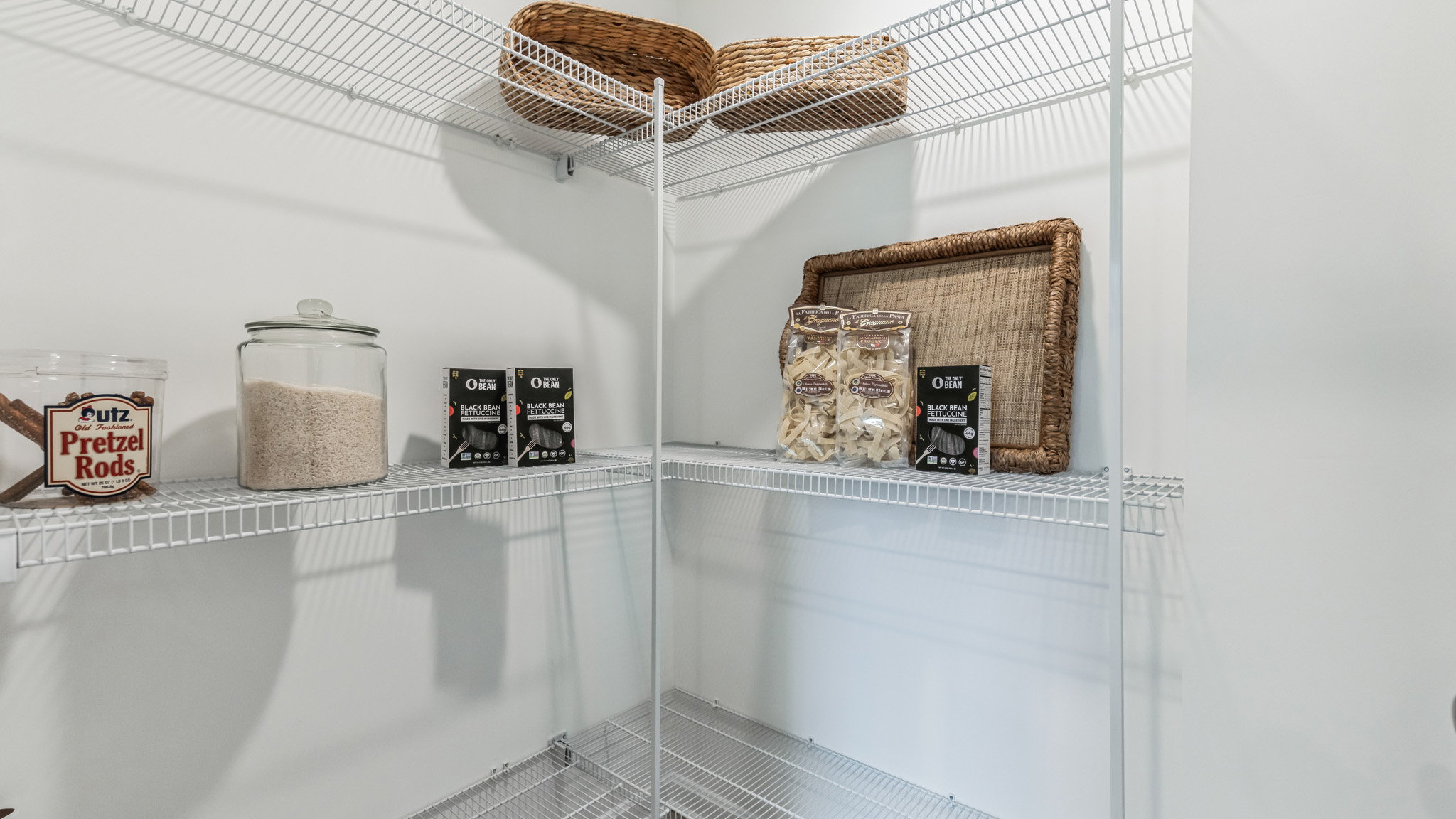 The well-designed gourmet kitchen features an oversized corner pantry.