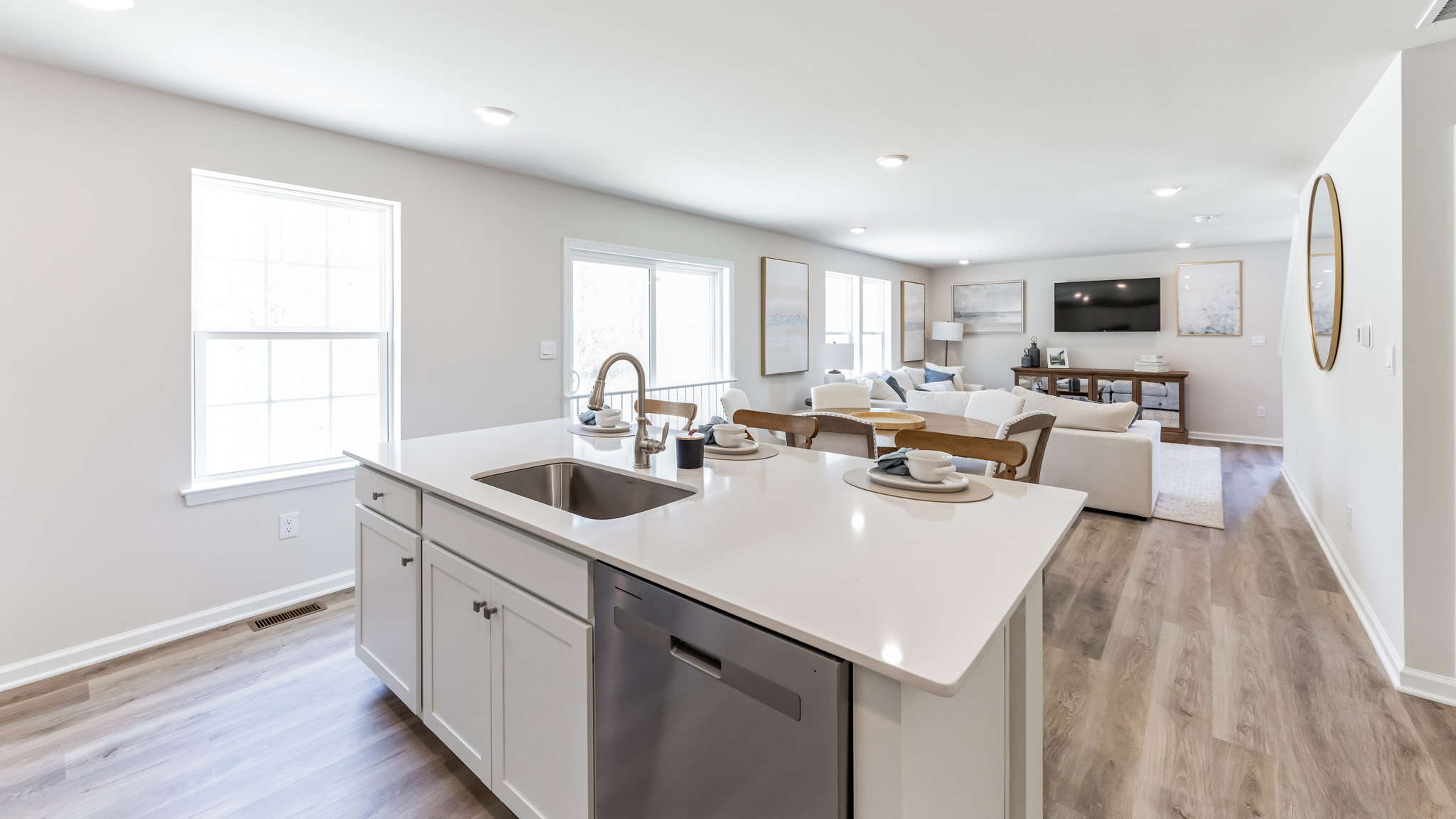 The spacious kitchen has a large island with view into the open living space.