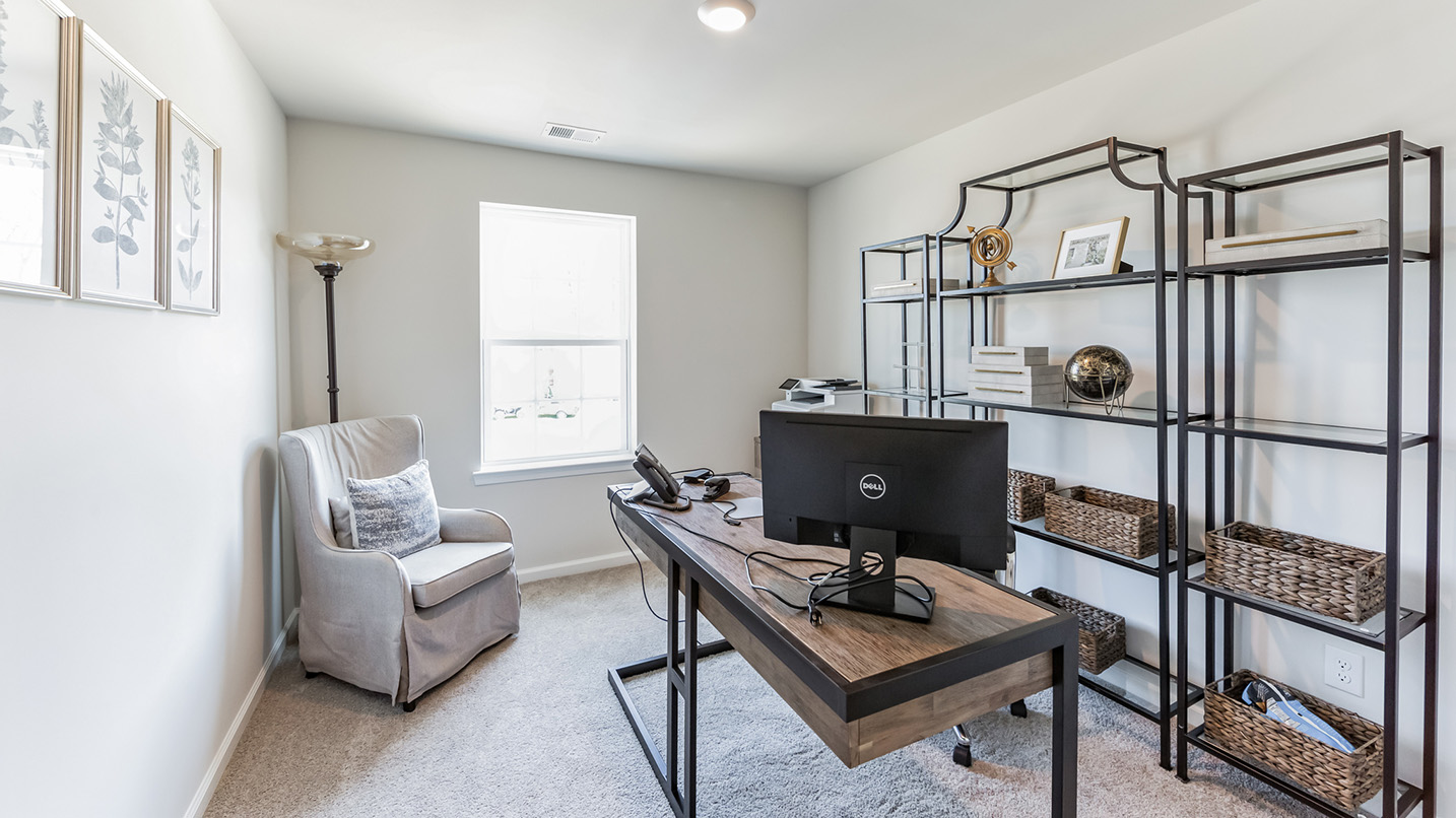 A guest bedroom with one window can be used as a home office.