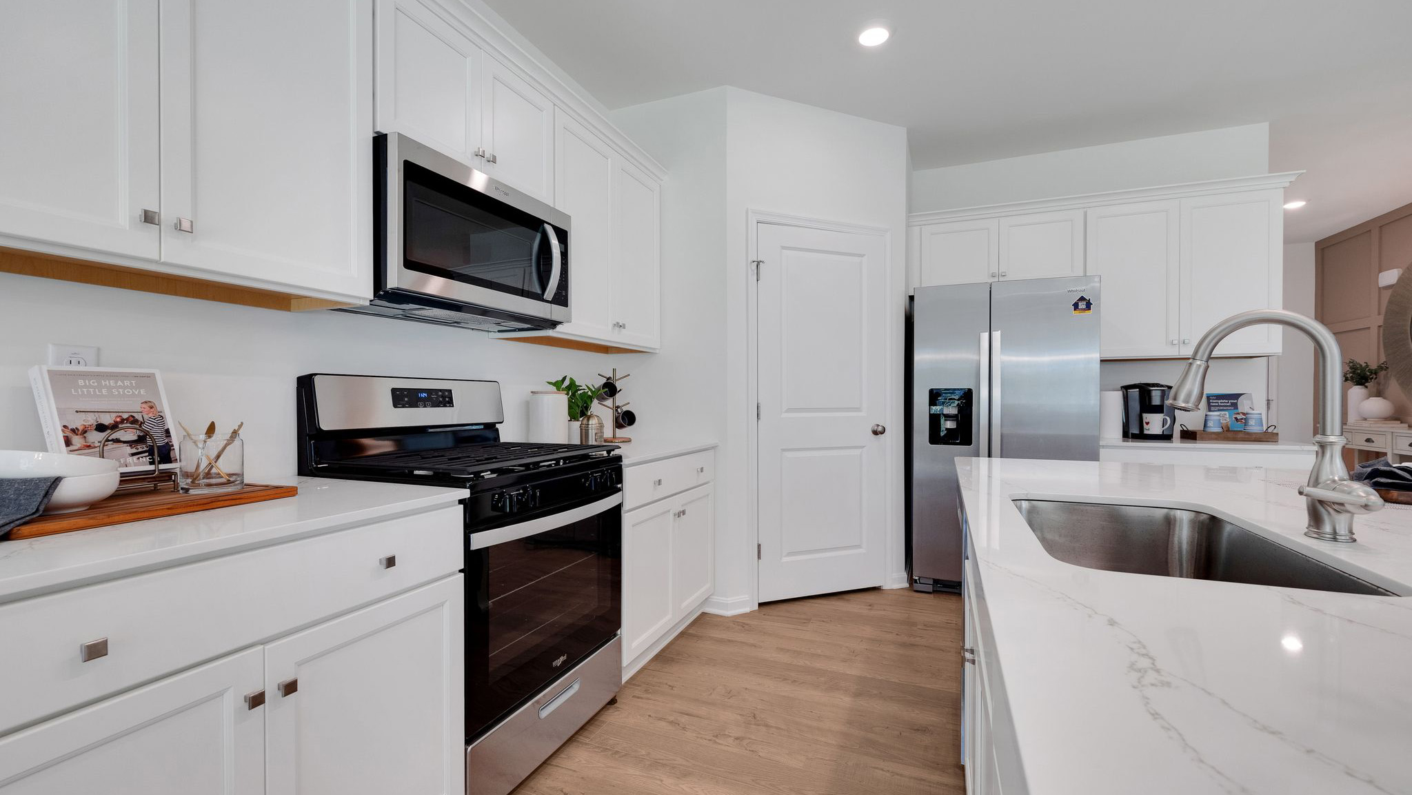 The well-designed gourmet kitchen features beautiful countertops.