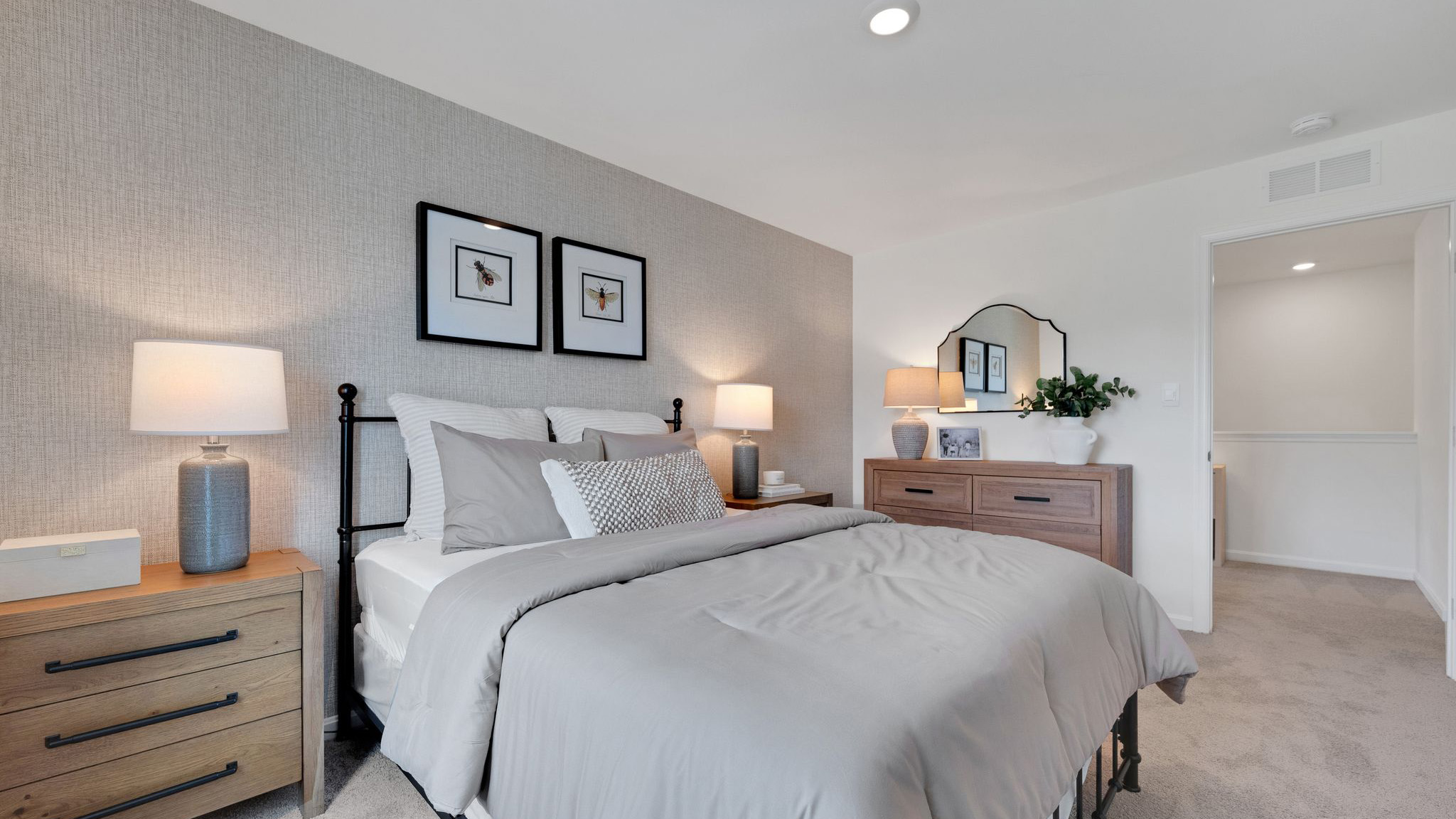 Three generously sized secondary bedrooms, and a hall bathroom with double vanity complete the upstairs.