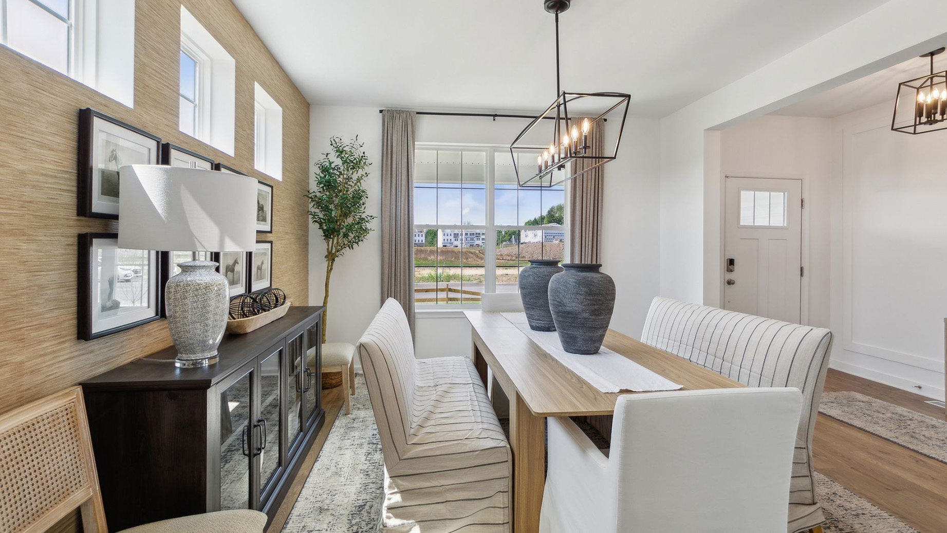 Formal dining room looking towards the front window and entrance.