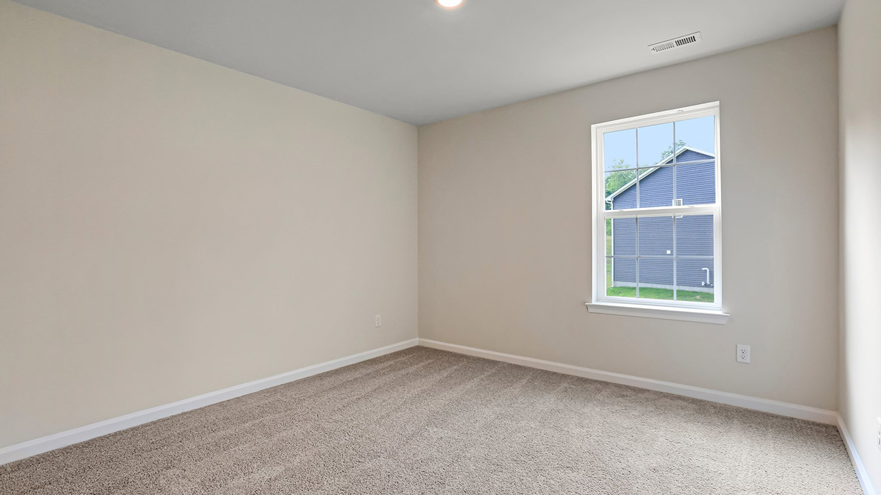 Bright secondary bedroom designed for privacy, comfort, and functionality with space to grow alongside your lifestyle.