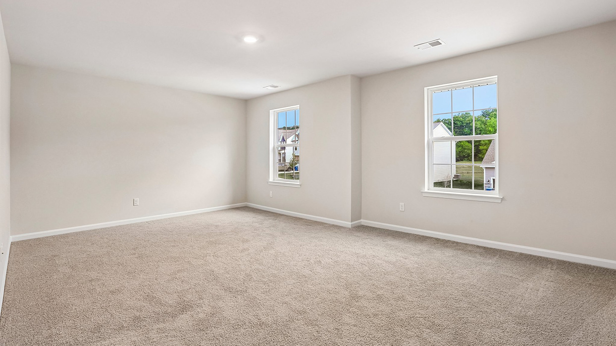 Expansive loft offering flexible living space for a media room, playroom, home office, fitness area, or additional gathering space.
