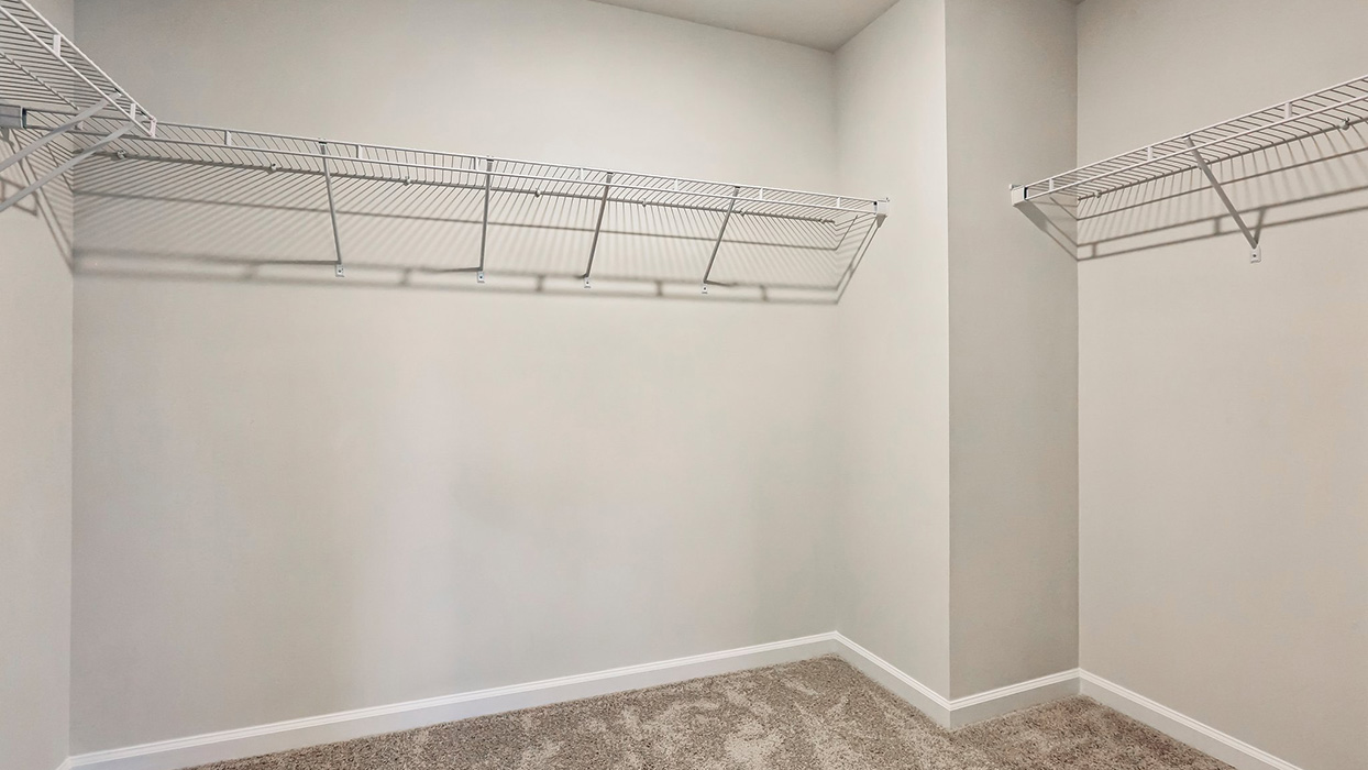 Spacious walk-in closet offering abundant storage and organization space to help keep everyday essentials easily accessible and neatly arranged.