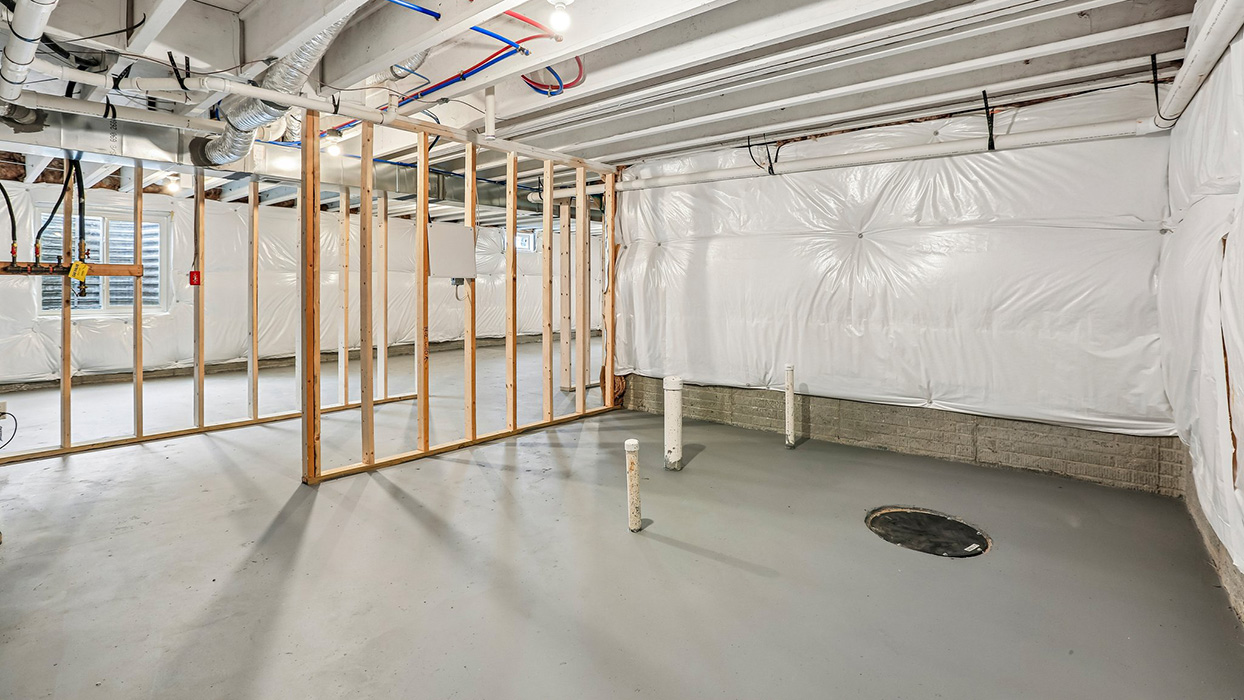 Versatile unfinished basement providing flexibility for future customization, additional gathering space, and long-term storage solutions tailored to your lifestyle.