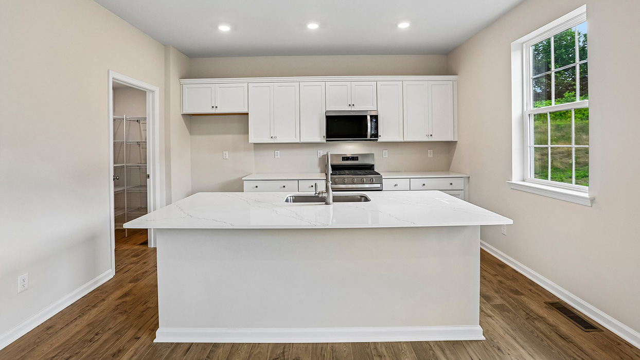 Contemporary kitchen with a large center island, abundant storage, and an efficient layout designed for everyday living and entertaining.