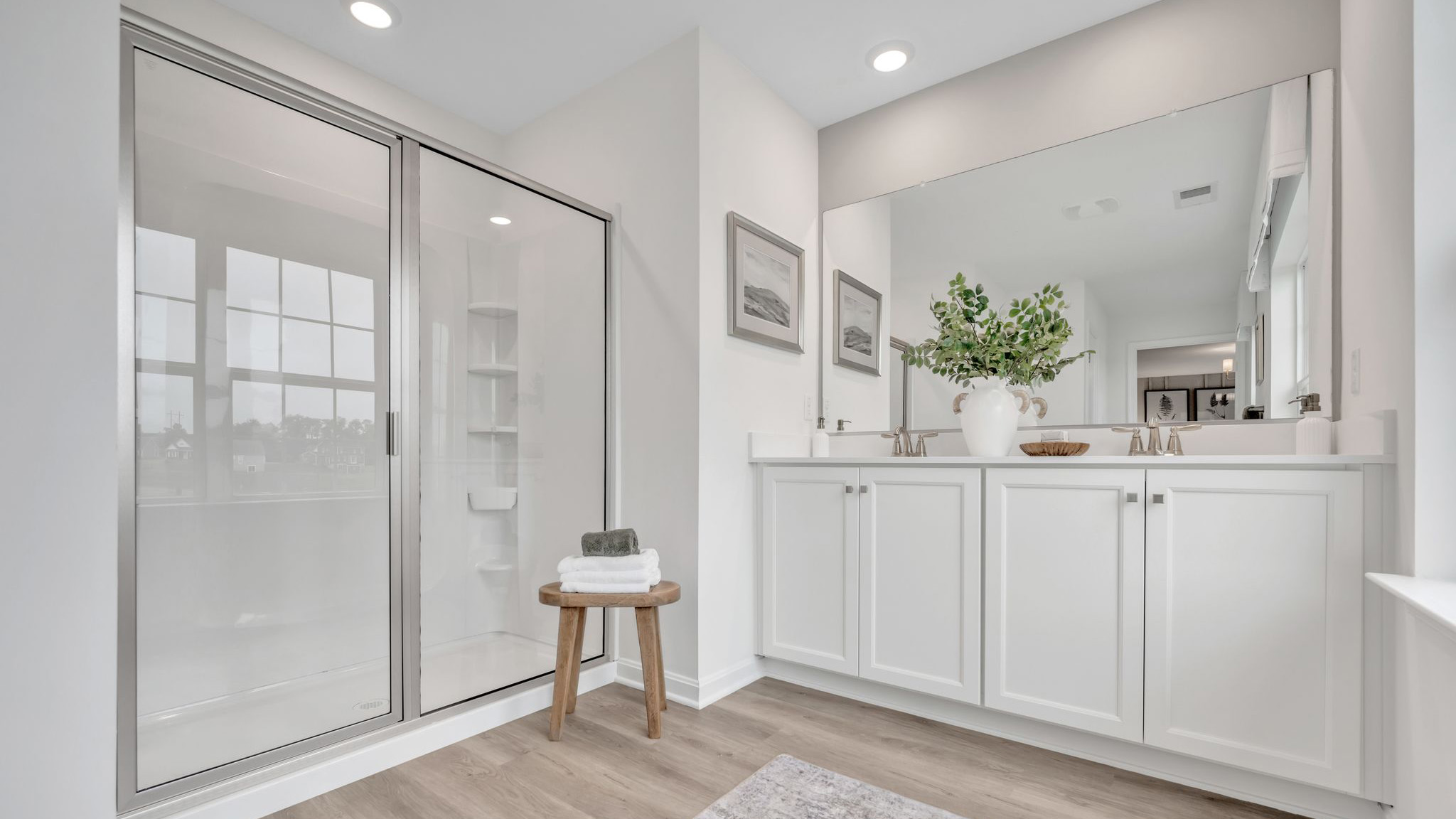 A contemporary owner’s bathroom with a large shower.