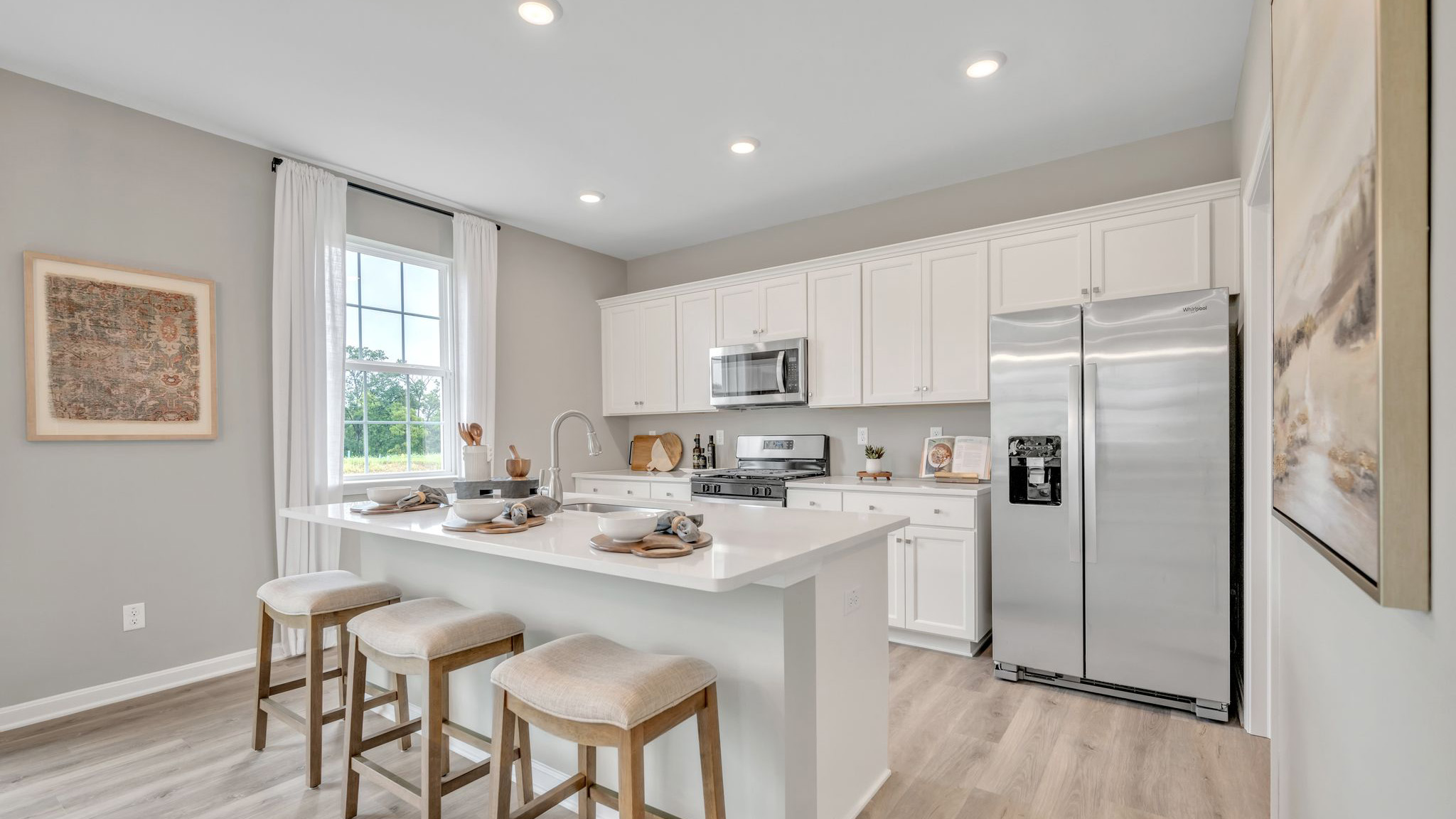 The well-designed gourmet kitchen features beautiful countertops.