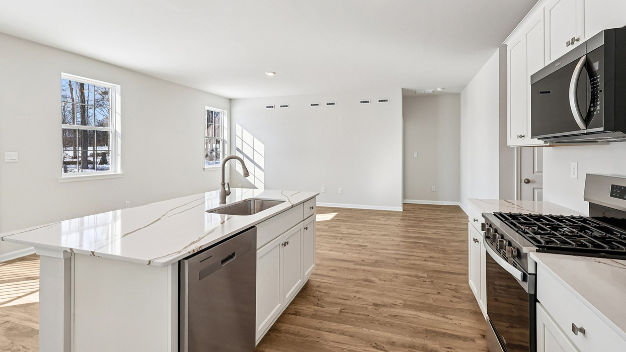 A different view from the rear of the kitchen looking out into the living area