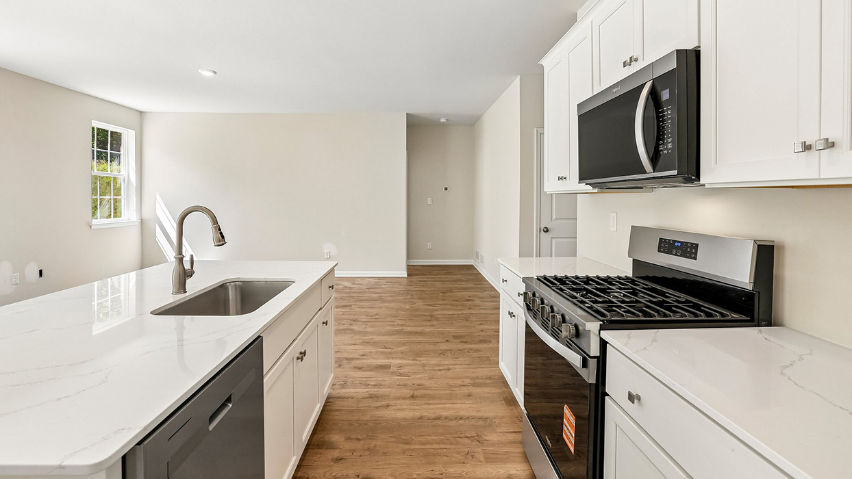 Walk-in pantry with wraparound wire shelving and ample storage space for organization.
