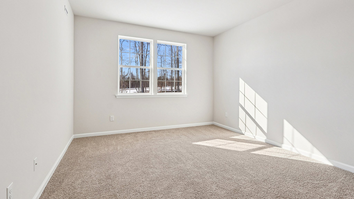 Primary bedroom with two windows