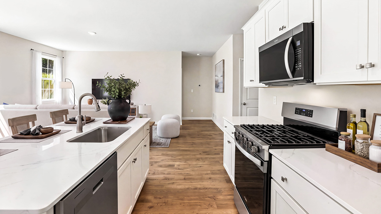 Walk-in pantry with wraparound wire shelving and ample storage space for organization.