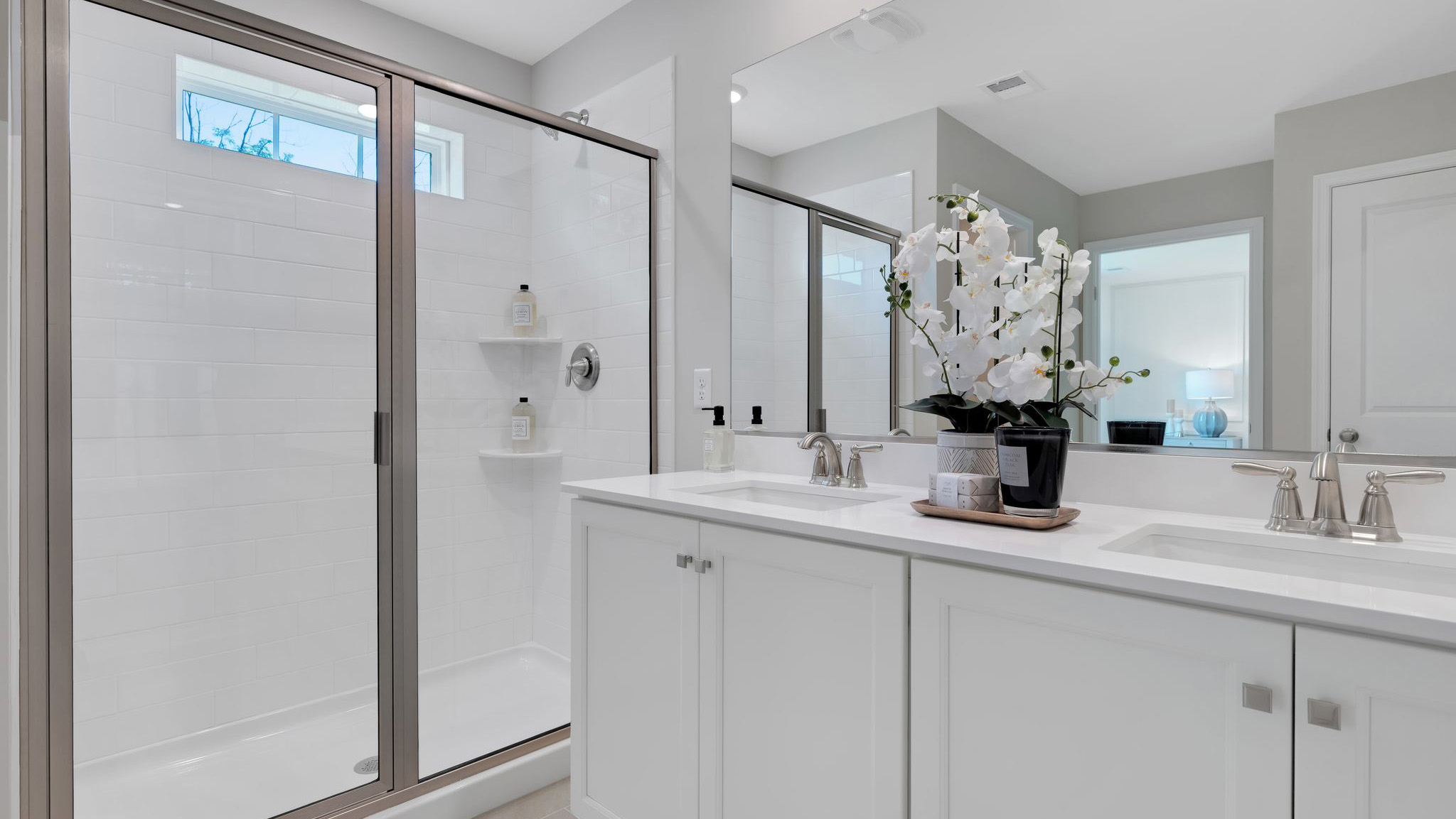 A contemporary owner’s bathroom with a large shower.