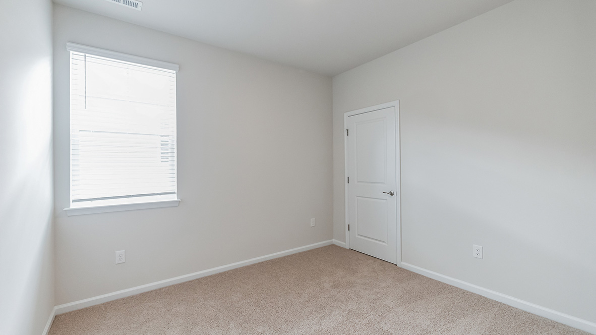 A third bedroom with one window and single closet door.