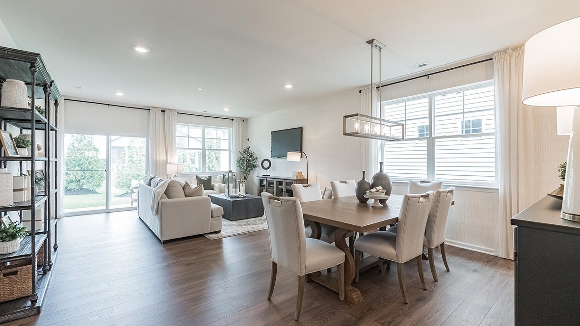 The kitchen is open to the informal dining area with a view into the living area.