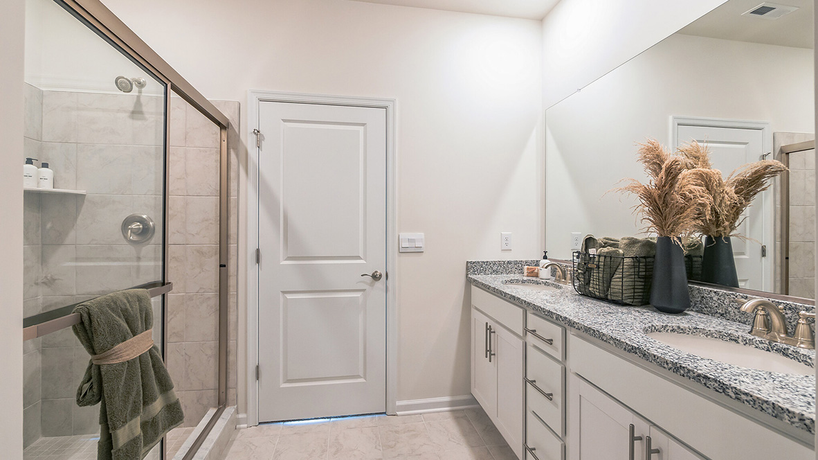 The primary bathroom with double bowl vanity.