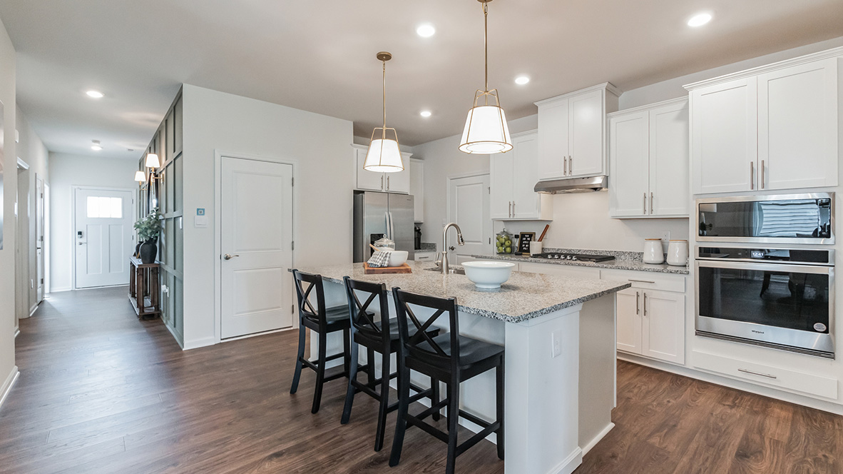 The dining area looks into the kitchen area.