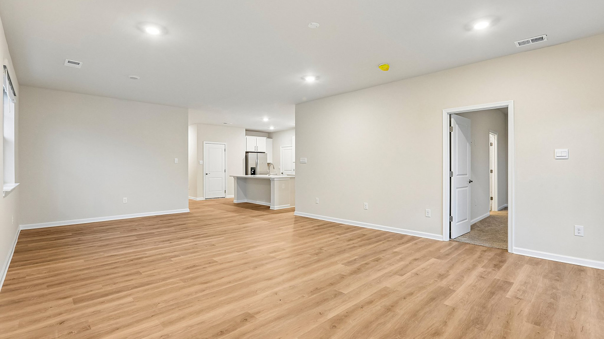 Expansive open-concept living space providing flexibility for entertaining, relaxing, and accommodating evolving household needs.