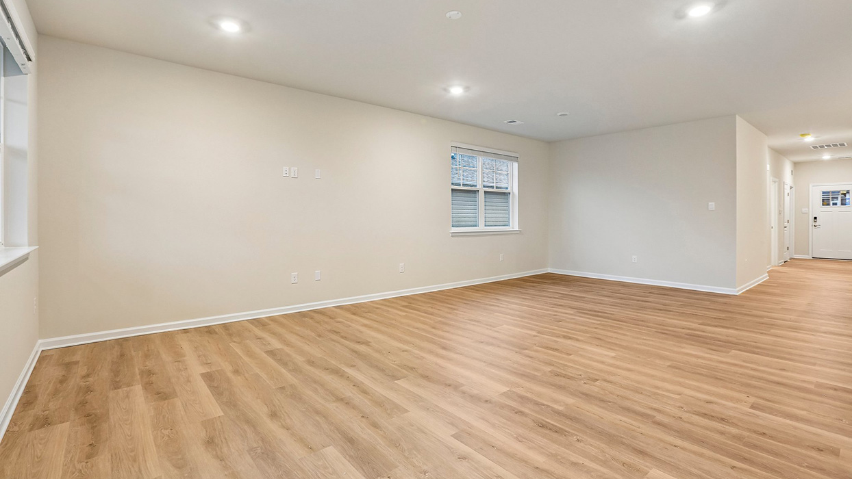 Private primary suite offering a spacious retreat with room for relaxation and convenient access to a walk-in closet and en-suite bath.