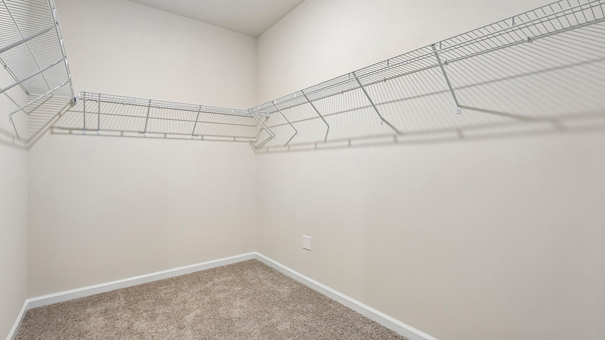 Generous walk-in closet offering ample storage and organization space for wardrobes, seasonal items, and everyday essentials.