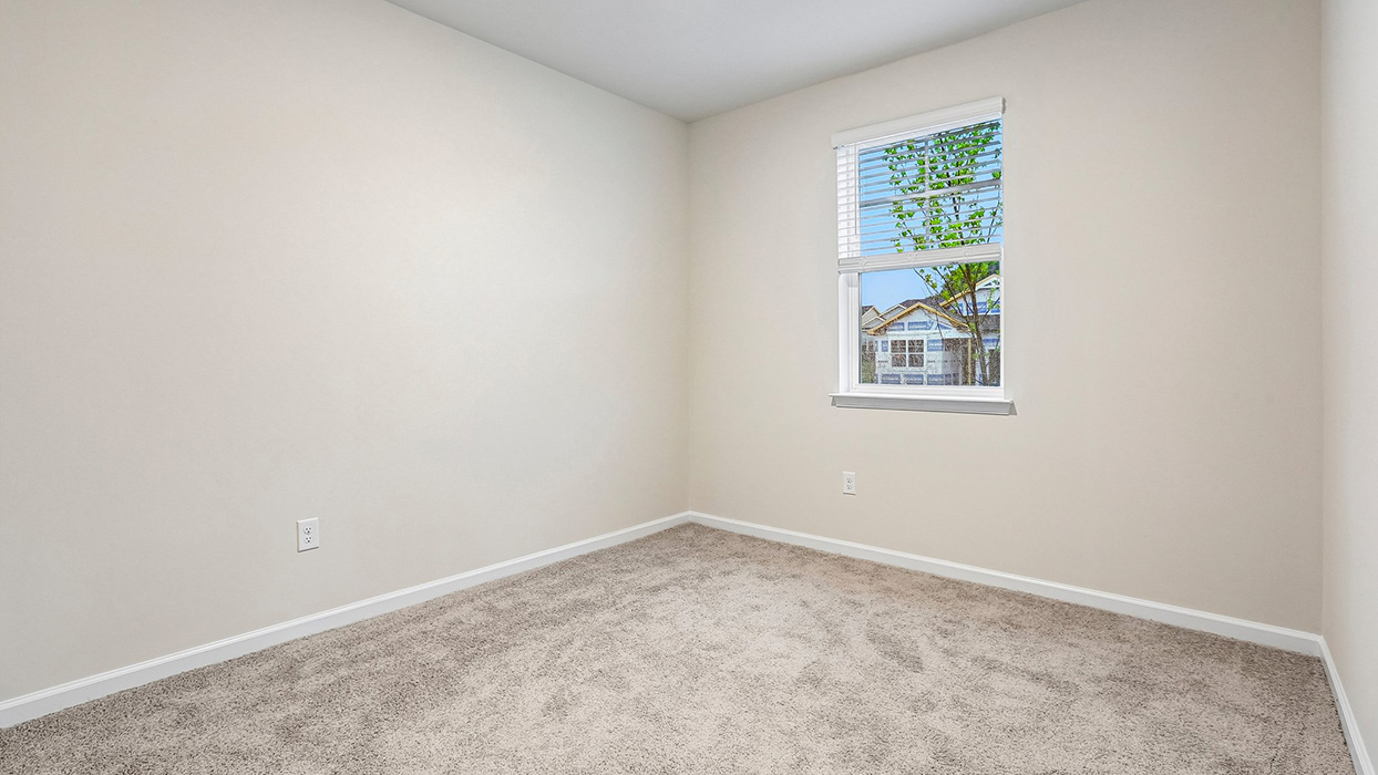 Versatile secondary bedroom providing privacy, natural light, and adaptability for a variety of household needs.