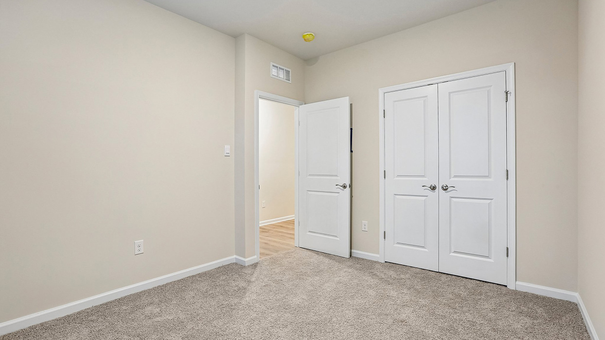 Well-sized bedroom featuring convenient closet storage and flexible space for family, guests, or personal pursuits.