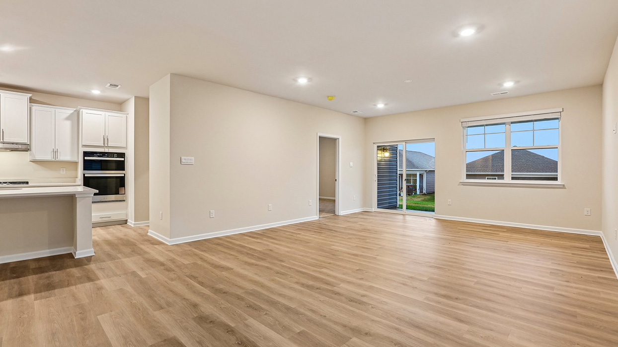 Spacious main living area with an open layout, abundant natural light, and direct access to outdoor living space.