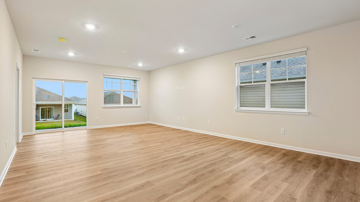 Flexible open-concept living space offering room for relaxation, entertaining, and a variety of furniture arrangements to fit your lifestyle.