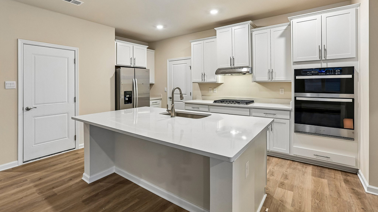 Thoughtfully designed kitchen with generous prep space, abundant cabinetry, and a functional layout ideal for daily routines and hosting guests.
