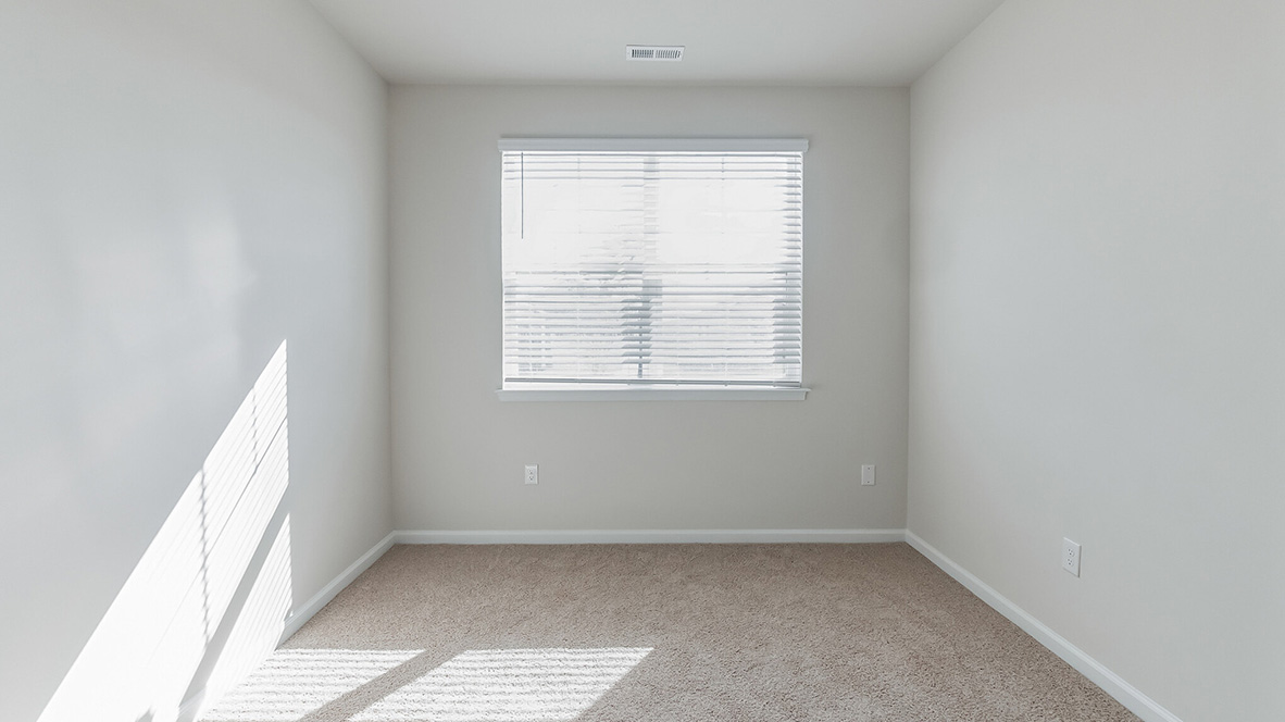 A third bedroom with a double window.