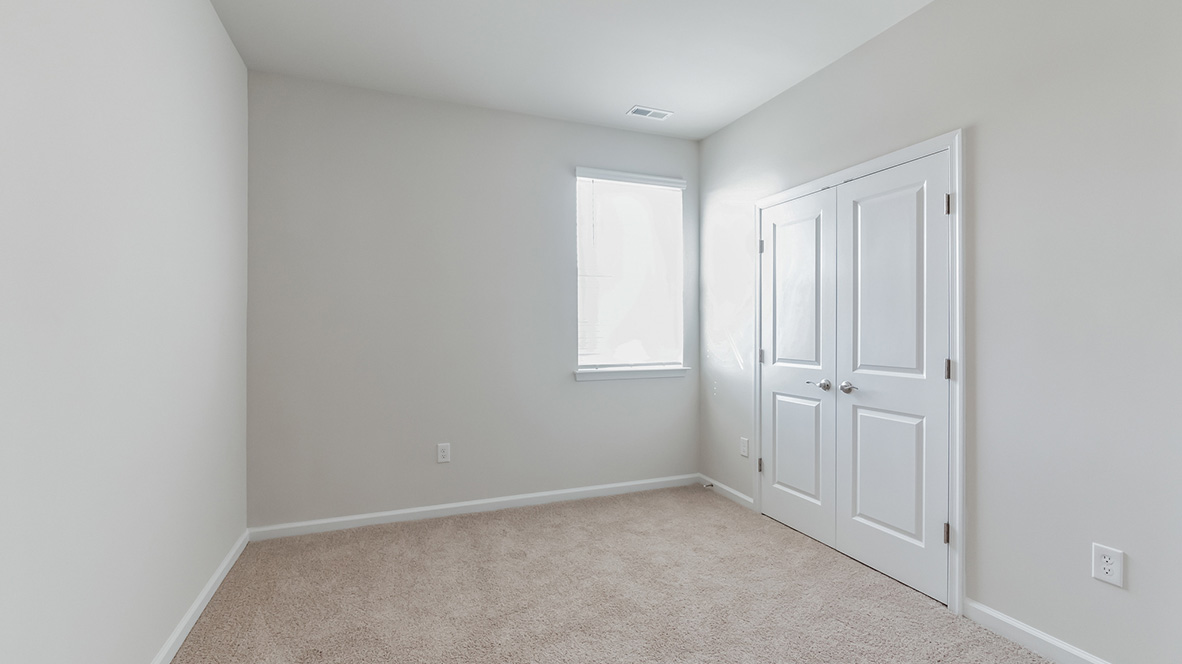 A fourth bedroom with a single window.