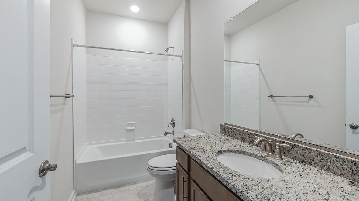 A second full bathroom is located near the second and third bedrooms.