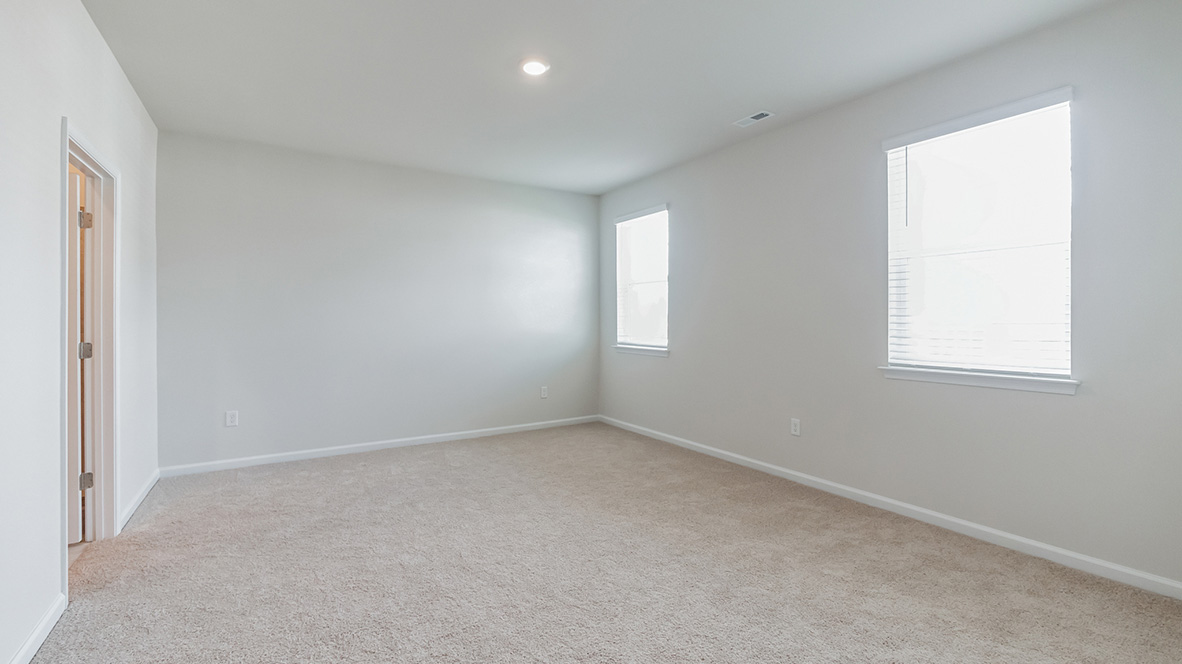 The primary bedroom is located of the living area.