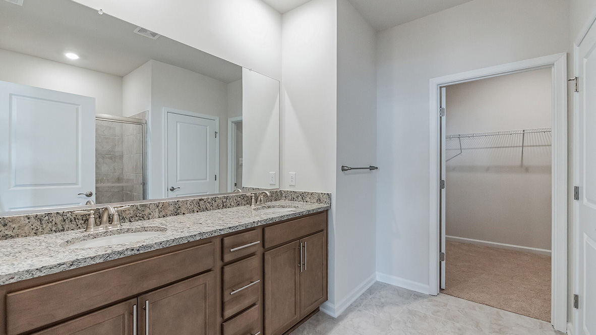 The primary bathroom with double bowl vanity.