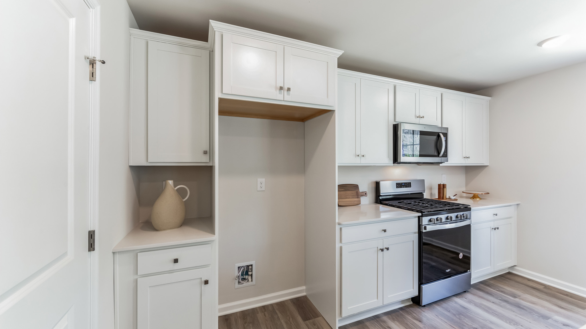 The kitchen offers sleek stainless steel appliances.